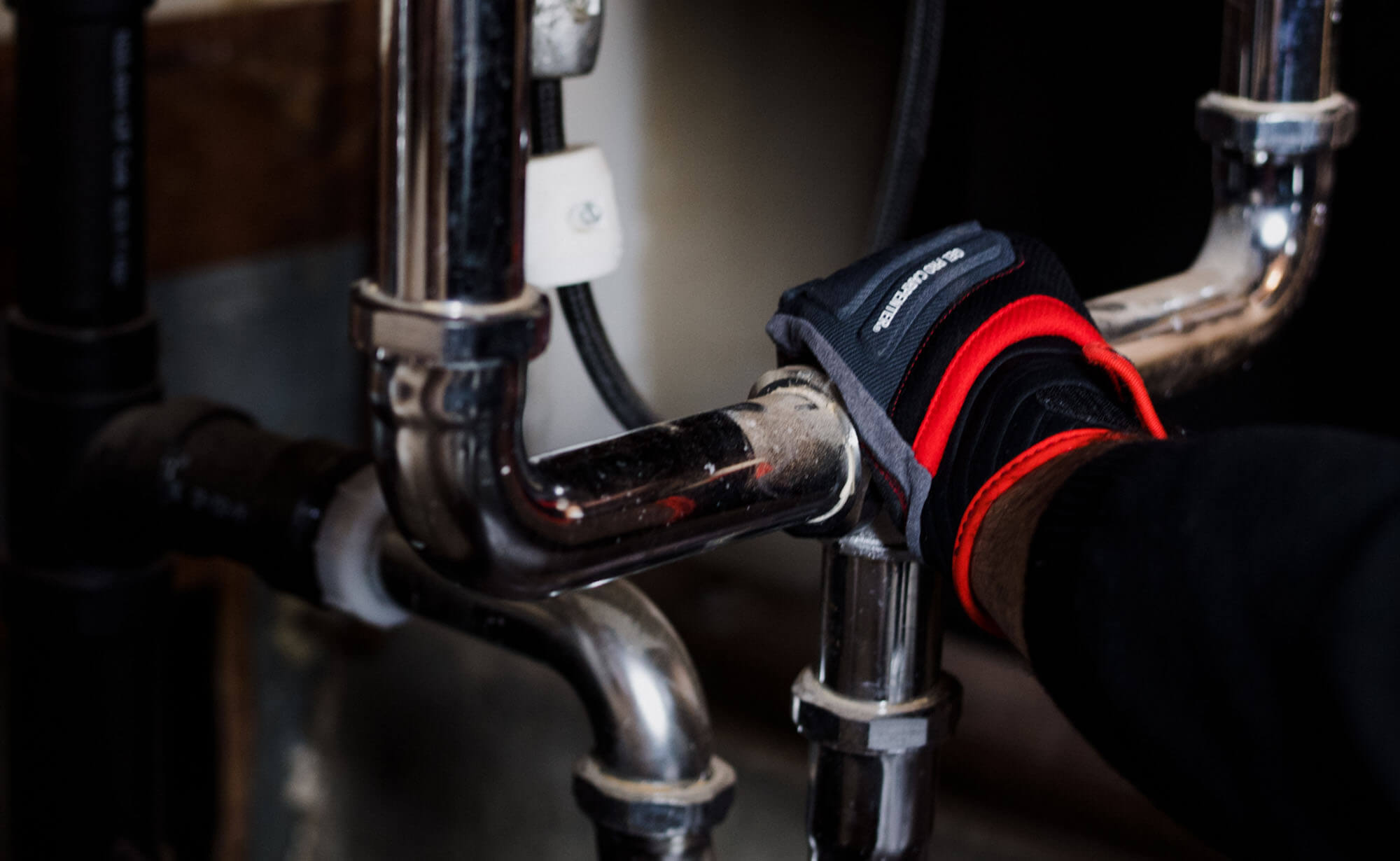 TAPS plumber performing plumbing repair inside Houston TX residential home