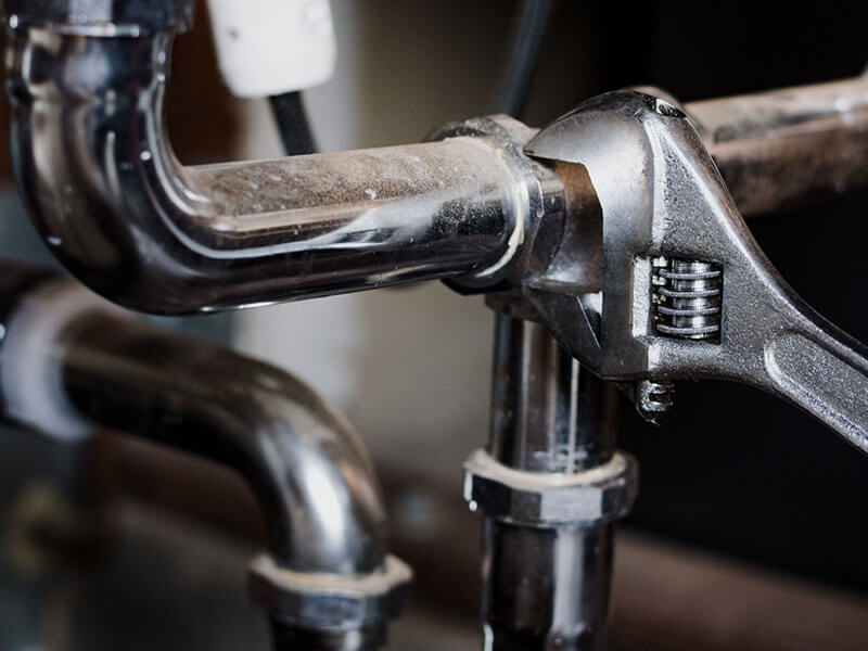 TAPS plumber performing residential plumbing repair in Houston TX home